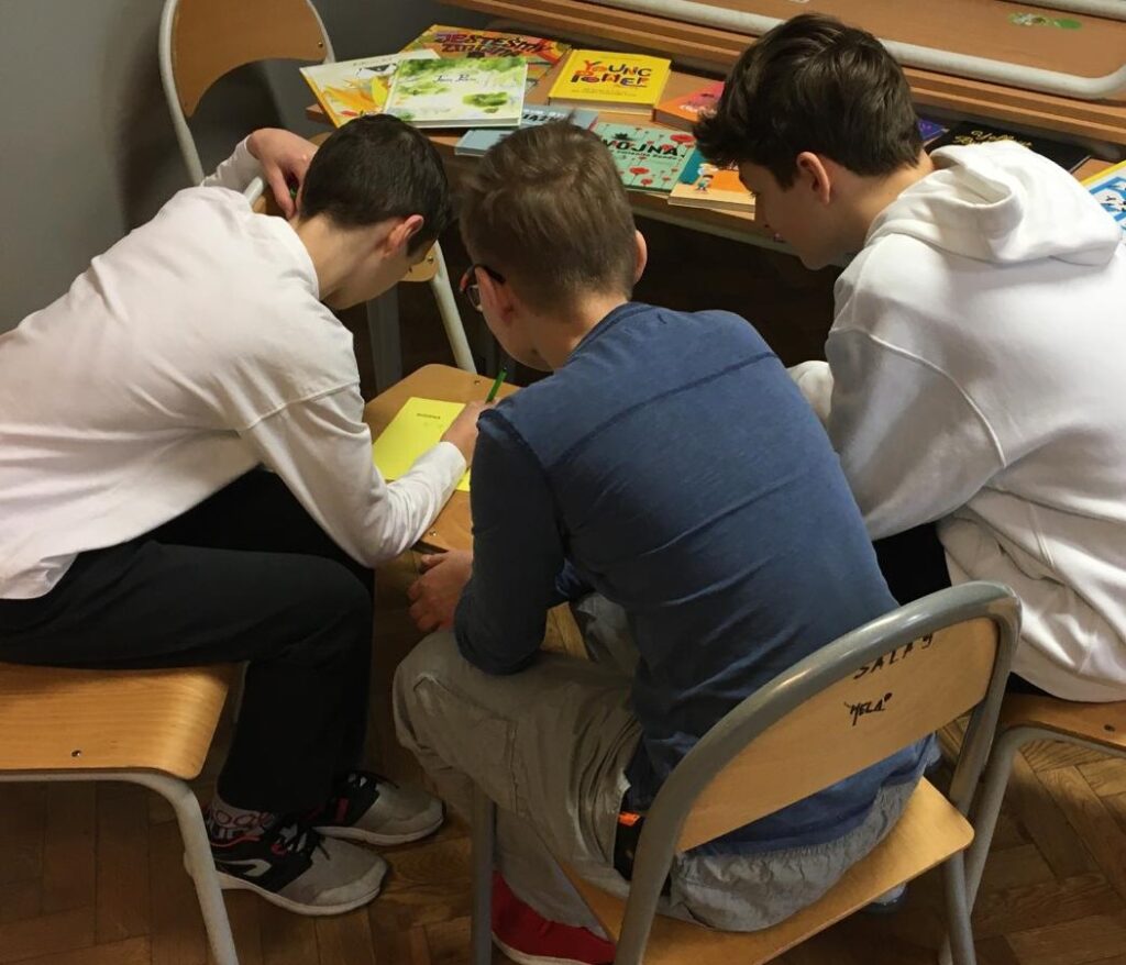 Children learning huddled around a table