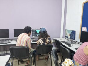 Andres, our AV artist, is showing the ropes to one of our participants