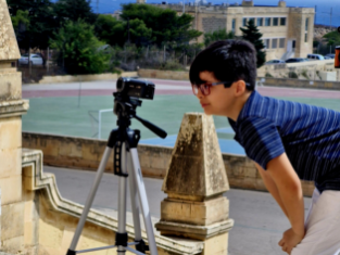 Child learning filmmaking