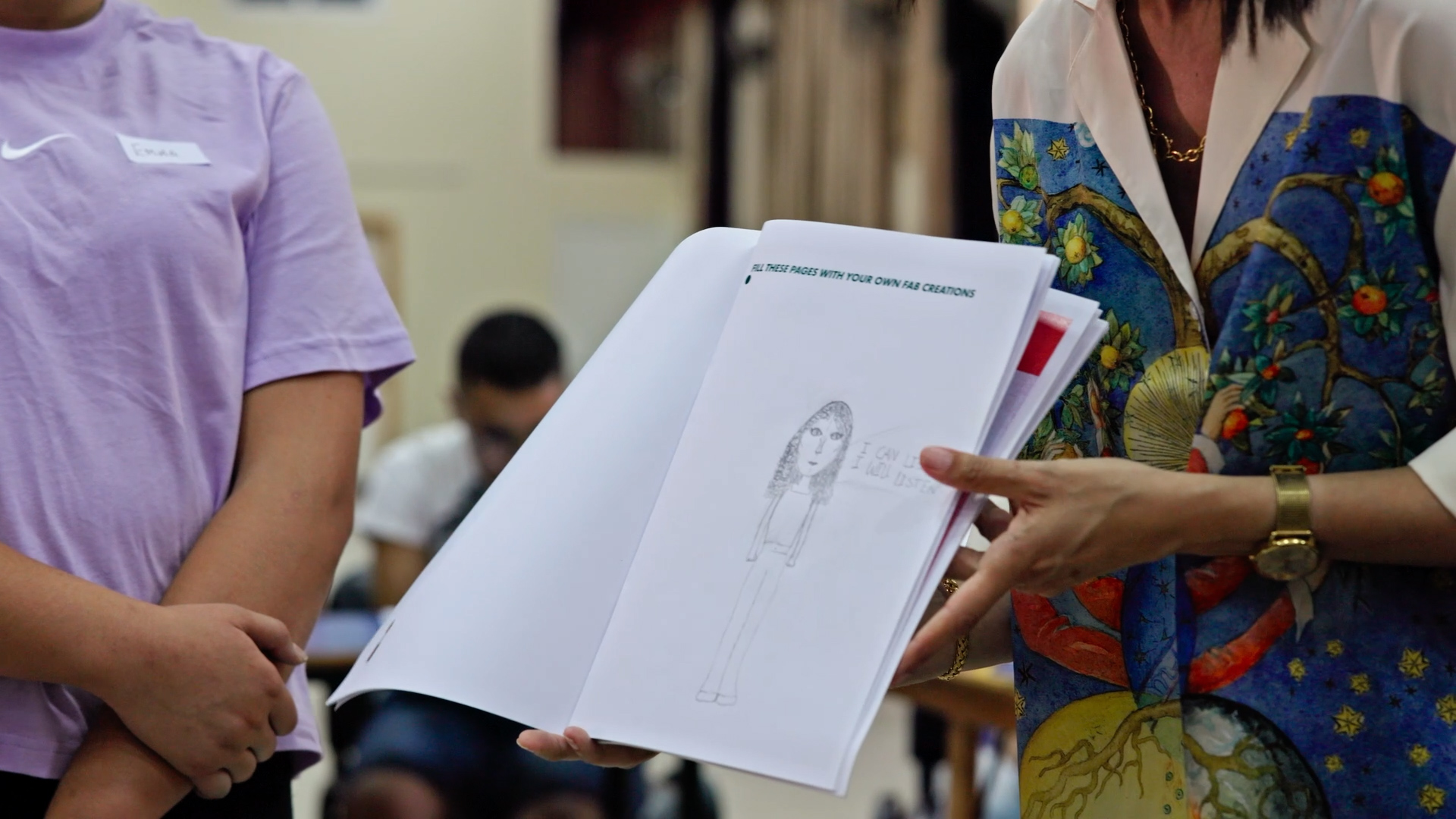 Children showing artwork