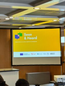 Screen showing images at an event