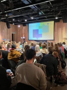 People speaking at an event