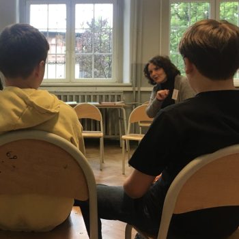 Tutor working with students