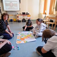 Intergenerational Justice and Safe Space People of different generations discussing ideas in a classroom setting
